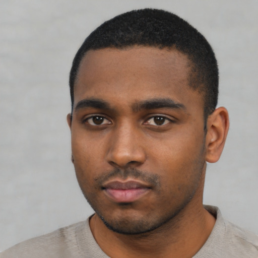 Neutral black young-adult male with short  black hair and brown eyes