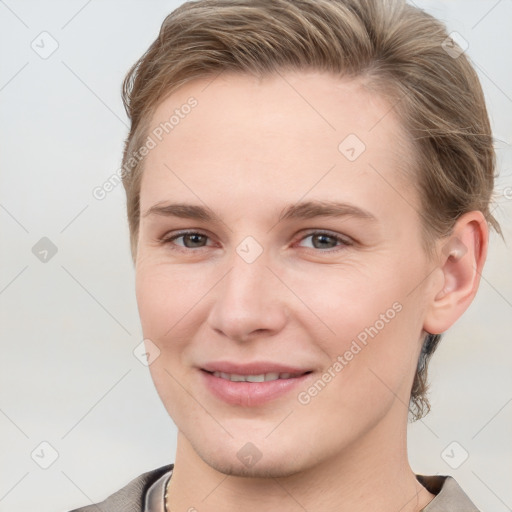 Joyful white young-adult female with short  brown hair and grey eyes