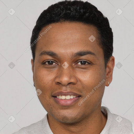 Joyful black young-adult male with short  black hair and brown eyes