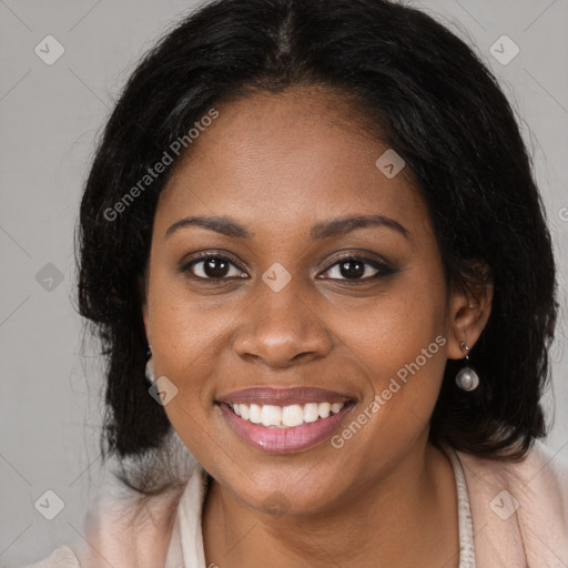 Joyful black young-adult female with medium  brown hair and brown eyes