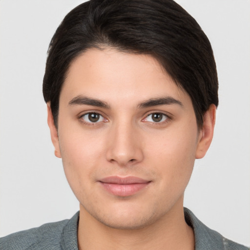 Joyful white young-adult male with short  brown hair and brown eyes