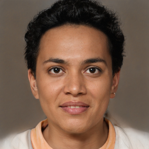Joyful latino young-adult female with short  brown hair and brown eyes