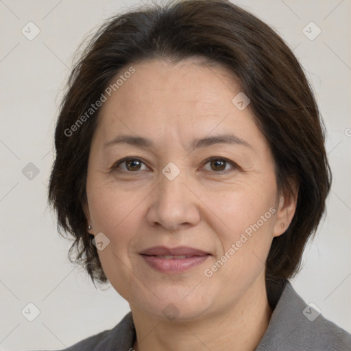 Joyful white adult female with medium  brown hair and brown eyes