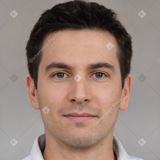 Joyful white young-adult male with short  brown hair and brown eyes