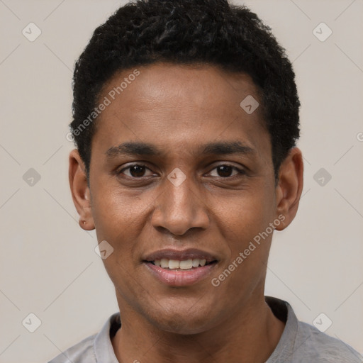 Joyful black young-adult male with short  black hair and brown eyes