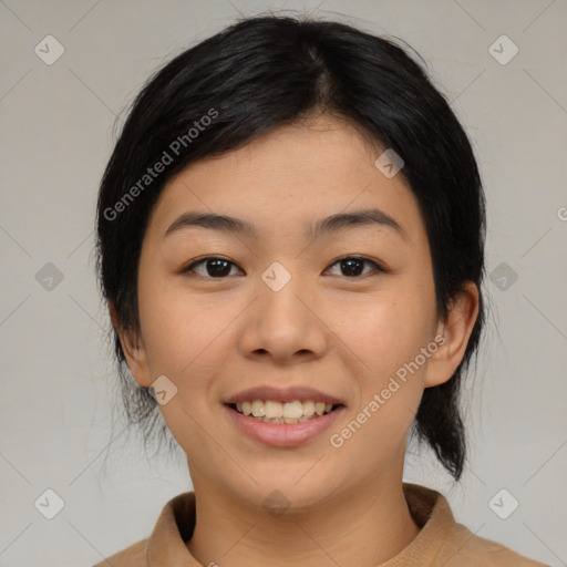 Joyful asian young-adult female with medium  black hair and brown eyes