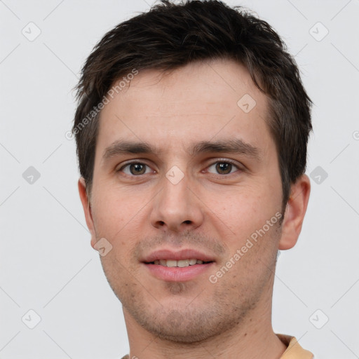 Joyful white young-adult male with short  brown hair and brown eyes