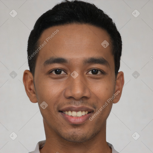 Joyful latino young-adult male with short  black hair and brown eyes