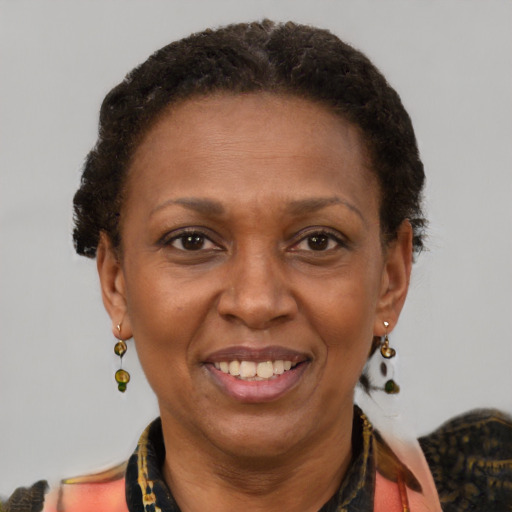 Joyful black adult female with short  brown hair and brown eyes
