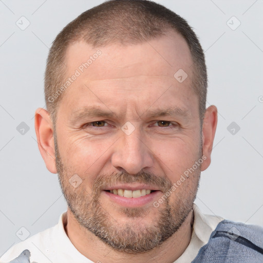 Joyful white adult male with short  brown hair and brown eyes