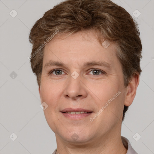 Joyful white adult male with short  brown hair and grey eyes