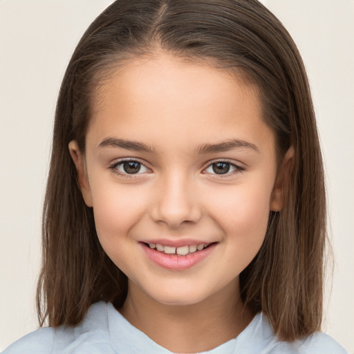 Joyful white child female with medium  brown hair and brown eyes