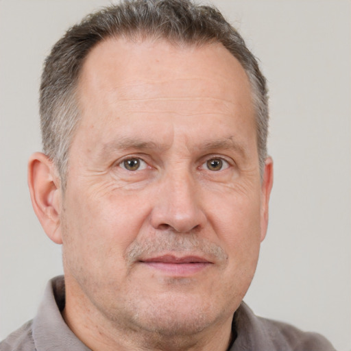 Joyful white middle-aged male with short  brown hair and brown eyes