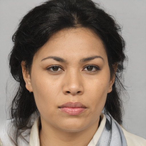 Joyful latino young-adult female with medium  brown hair and brown eyes