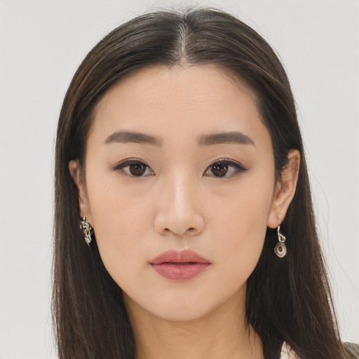 Neutral asian young-adult female with long  brown hair and brown eyes