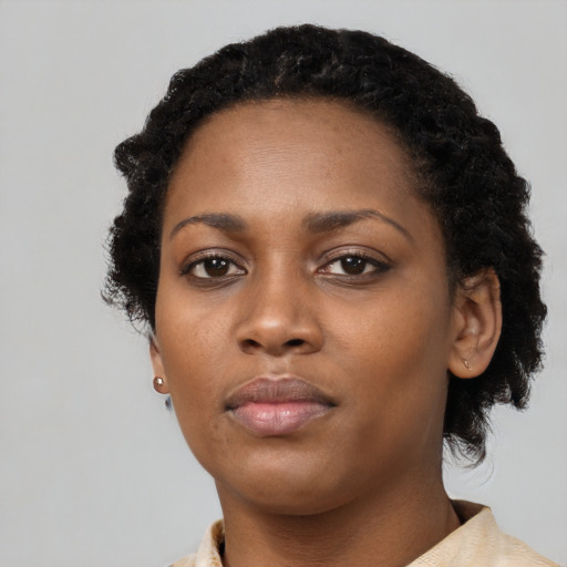 Neutral black young-adult female with short  black hair and brown eyes