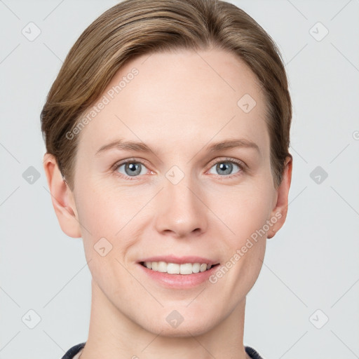 Joyful white young-adult female with short  brown hair and grey eyes