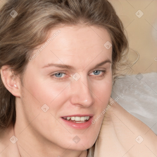 Joyful white adult female with medium  brown hair and blue eyes