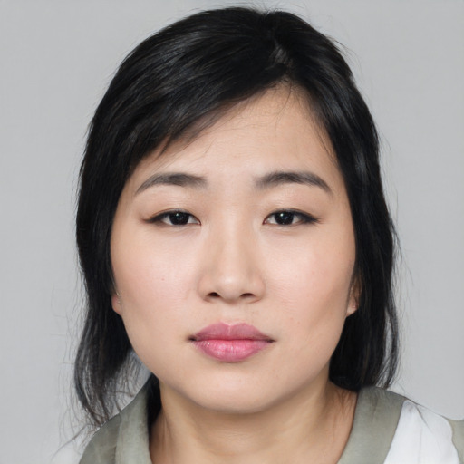 Neutral asian young-adult female with medium  black hair and brown eyes