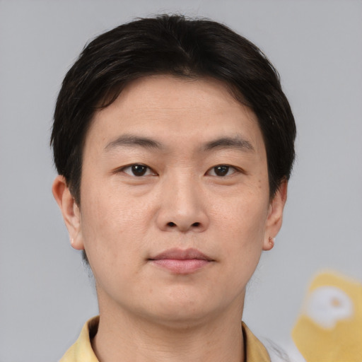 Neutral asian young-adult male with short  brown hair and brown eyes