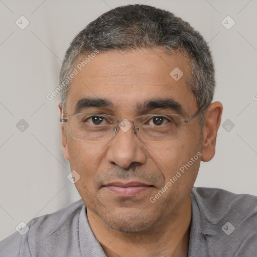 Joyful white adult male with short  black hair and brown eyes