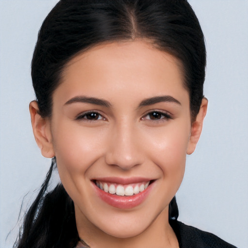 Joyful white young-adult female with long  black hair and brown eyes