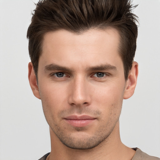 Neutral white young-adult male with short  brown hair and brown eyes