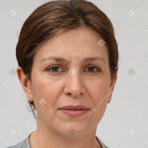 Joyful white adult female with short  brown hair and grey eyes