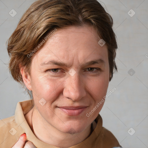 Joyful white adult female with medium  brown hair and grey eyes