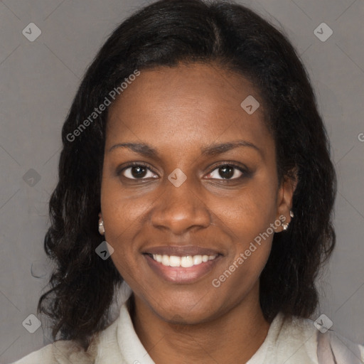 Joyful black young-adult female with medium  brown hair and brown eyes