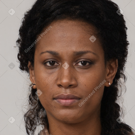 Neutral black adult female with long  brown hair and brown eyes