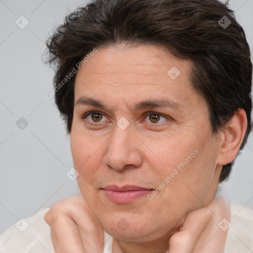 Joyful white adult female with short  brown hair and brown eyes