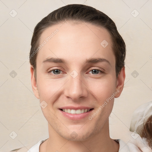 Joyful white young-adult female with short  brown hair and brown eyes