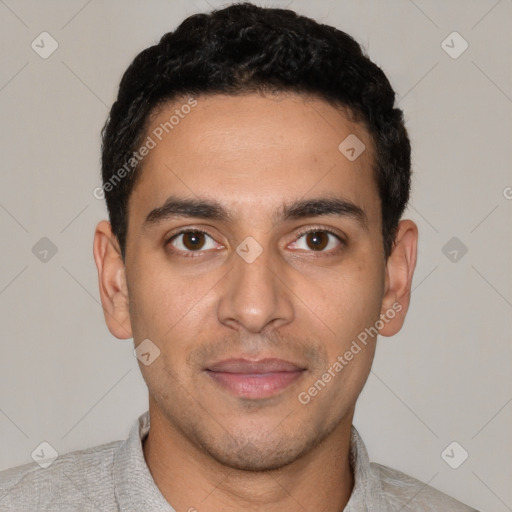 Joyful white young-adult male with short  black hair and brown eyes