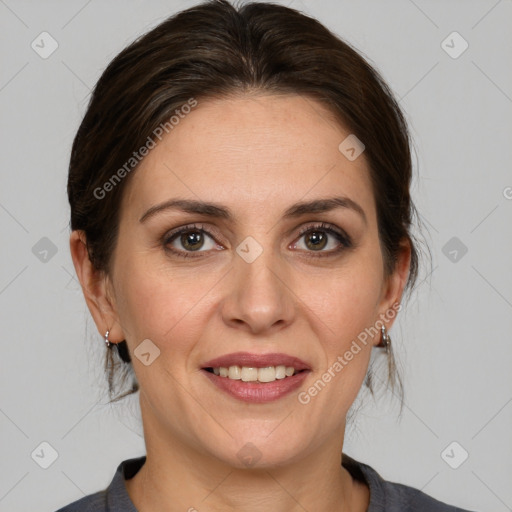 Joyful white adult female with medium  brown hair and grey eyes