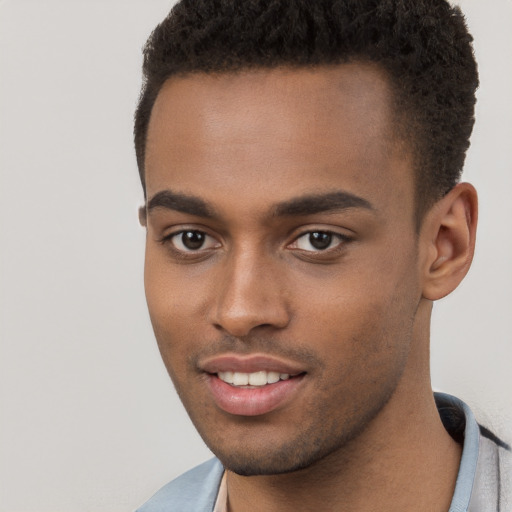 Joyful black young-adult male with short  brown hair and brown eyes