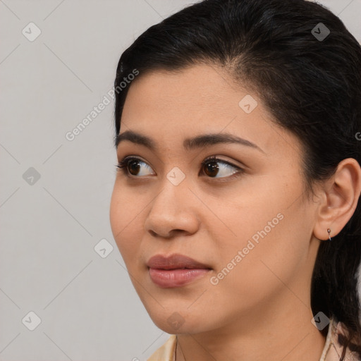 Joyful latino young-adult female with medium  black hair and brown eyes