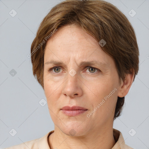 Joyful white adult female with short  brown hair and grey eyes