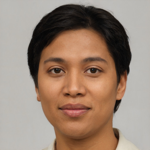 Joyful asian young-adult female with short  brown hair and brown eyes