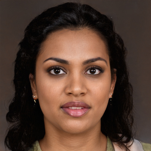 Joyful latino young-adult female with long  black hair and brown eyes