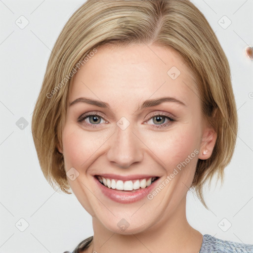 Joyful white young-adult female with medium  brown hair and blue eyes