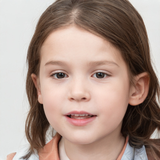 Joyful white child female with medium  brown hair and grey eyes