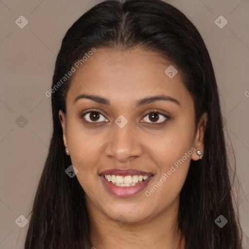 Joyful latino young-adult female with long  brown hair and brown eyes