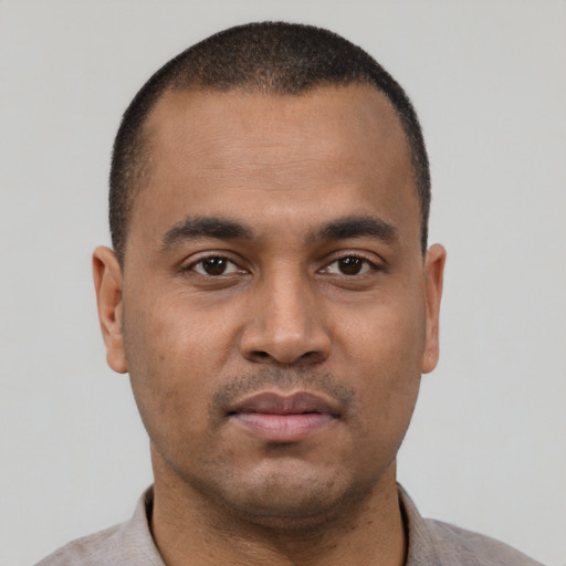 Neutral latino young-adult male with short  brown hair and brown eyes