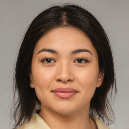 Joyful asian young-adult female with medium  brown hair and brown eyes