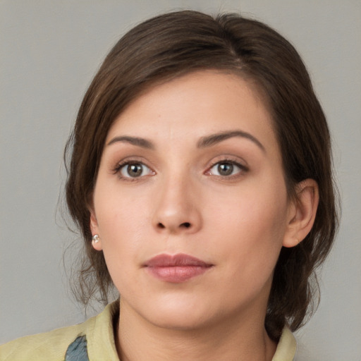 Neutral white young-adult female with medium  brown hair and brown eyes