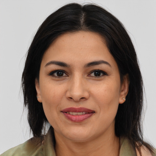Joyful asian adult female with medium  brown hair and brown eyes