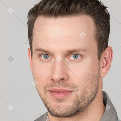 Neutral white young-adult male with short  brown hair and grey eyes