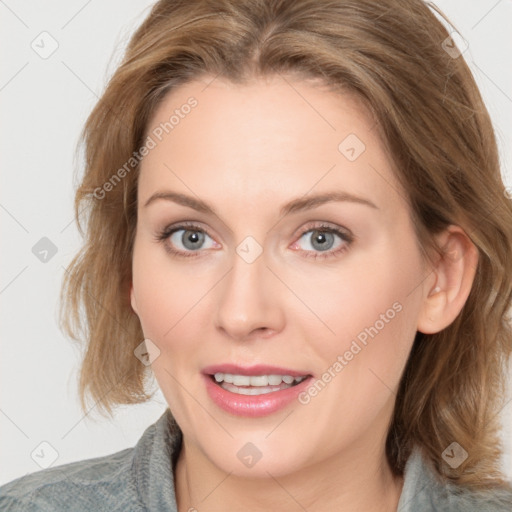 Joyful white young-adult female with medium  brown hair and blue eyes