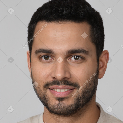 Joyful white young-adult male with short  black hair and brown eyes